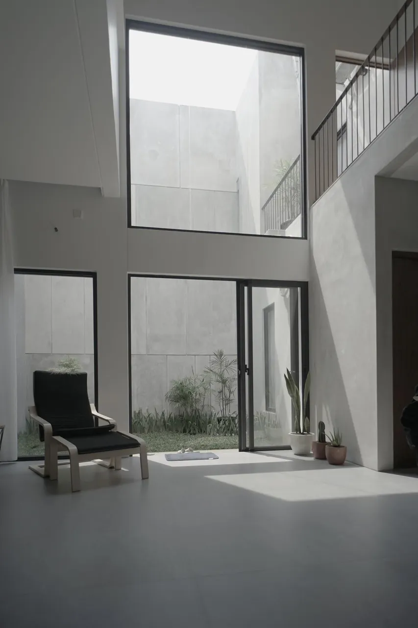 Rumah Anas — double-height living area and courtyard
